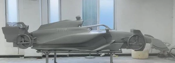 Grey primed show-car body before paint and wheel installation